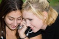 Friends on Cell Phone together (Beautiful Young Blonde and Brunette Girls)