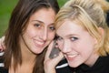 Friends on Cell Phone together (Beautiful Young Blonde and Brunette Girls)