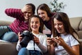 Friends checking photos on a camera Royalty Free Stock Photo