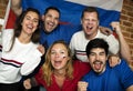 Friends cheering world cup with painted flag Royalty Free Stock Photo