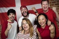 Friends cheering world cup with painted flag