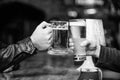Friends cheers glasses. Friday leisure tradition. Beer pub concept. Beer mug on bar counter defocused background. Glass