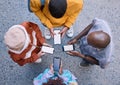 Friends, circle and phone in top view, outdoor and texting on social media, app and web communication. Group, gen z Royalty Free Stock Photo