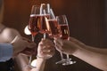 Friends clinking glasses with champagne on blurred background Royalty Free Stock Photo