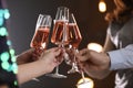 Friends clinking glasses with champagne on blurred background Royalty Free Stock Photo