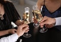 Friends clinking glasses of champagne in restaurant Royalty Free Stock Photo