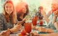 Friends at coffee shop having a laugh and a coffee break. Royalty Free Stock Photo