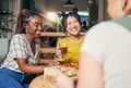 Friends, conversation and women with food in home for relaxing, bonding and lunch together. Friendship, happy and group Royalty Free Stock Photo