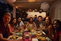 Friends at a dinner party on a patio looking to camera Royalty Free Stock Photo