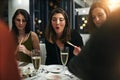 Friends, dinner party and at a restaurant for celebration, happiness or eating. Young people, women and champagne for Royalty Free Stock Photo
