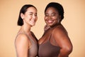 Friends, diversity and beauty of plus size women in studio on a brown background. Empowerment portrait