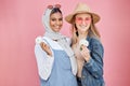 Friends, diversity and fashion women portrait with spring flowers on a pink background with a happy smile. Muslim woman