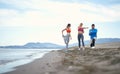 Friends doing exercises on the beach Royalty Free Stock Photo