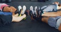 Friends dont let friends skip leg day. a group of people lying together in a circle during their workout at a gym. Royalty Free Stock Photo