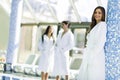 Friends relaxing in a spa next to a swimming pool Royalty Free Stock Photo