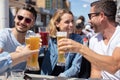 friends drinking beer and having fun outdoors Royalty Free Stock Photo