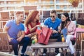 Friends drinking cocktails outdoor on a penthouse balcony Royalty Free Stock Photo