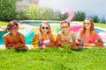 Friends drinking cocktails during pool party Royalty Free Stock Photo