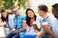 Friends drinking coffee and juice talking in city Royalty Free Stock Photo