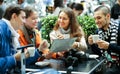 Friends drinking coffee outdoors Royalty Free Stock Photo