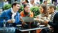 Friends drinking coffee outdoors Royalty Free Stock Photo