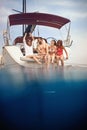 Friends drinking and having party on sailing boat Royalty Free Stock Photo
