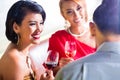 Friends drinking wine in fancy bar Royalty Free Stock Photo