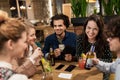 Friends with drinks, money and bill at bar Royalty Free Stock Photo