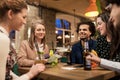 Friends with drinks, money and bill at bar Royalty Free Stock Photo