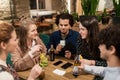 Friends with drinks, money and bill at bar Royalty Free Stock Photo