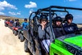 Friends driving off-road with quad bike or ATV and UTV vehicles