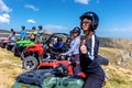 Friends driving off-road with quad bike or ATV and UTV vehicles Royalty Free Stock Photo