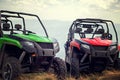 Friends driving off-road with quad bike or ATV and UTV vehicles