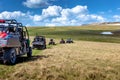 Friends driving off-road with quad bike or ATV and UTV vehicles Royalty Free Stock Photo