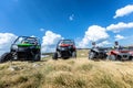 Friends driving off-road with quad bike or ATV and UTV vehicles Royalty Free Stock Photo