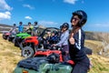 Friends driving off-road with quad bike or ATV and UTV vehicles Royalty Free Stock Photo