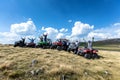 Friends driving off-road with quad bike or ATV and UTV vehicles