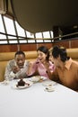 Friends eating dessert.