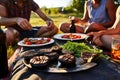 friends eating grilled portobello mushrooms at a picnic