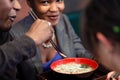 Friends eating noodle soup in Japanese Restaurant Royalty Free Stock Photo