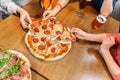 friends eating pizza with beer at restaurant Royalty Free Stock Photo