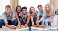 Friends eating pizza at home Royalty Free Stock Photo