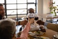 Friends eating together and drinking wine Royalty Free Stock Photo