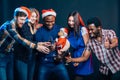 Friends Enjoying Christmas Drinks In Bar Royalty Free Stock Photo