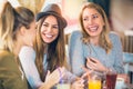 Friends enjoying in conversation and drinking coffee. Royalty Free Stock Photo