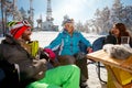 Friends enjoying on drink at ski resort Royalty Free Stock Photo