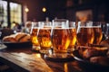 Friends enjoying happy hour at brewery pub closeup of beer glasses food and beverage concept Royalty Free Stock Photo