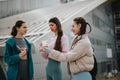 Friends enjoying ice cream together in an urban setting on a sunny day