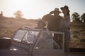 Friends enjoying in vehicle during safari vacation Royalty Free Stock Photo