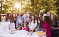 Friends and family in garden celebrating a childÃ¯Â¿Â½s birthday